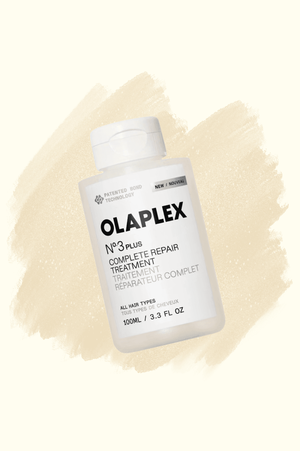 An Olaplex No.3 PLUS Complete Repair Treatment bottle on a cream brushstroke background