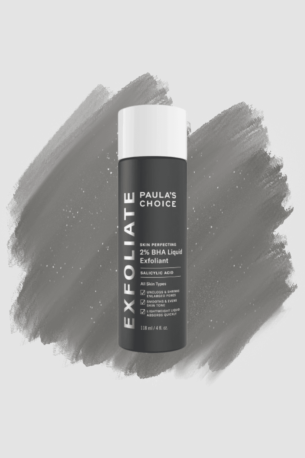 A Paula's Choice 2% BHA Liquid Exfoliant bottle on a grey brushstroke background