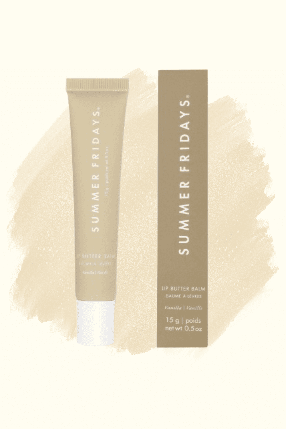 A Summer Fridays Lip Butter Balm tube in Vanilla beside its box, on a cream brushstroke background